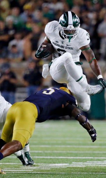 Mich St RB Scott charged with driving on suspended license